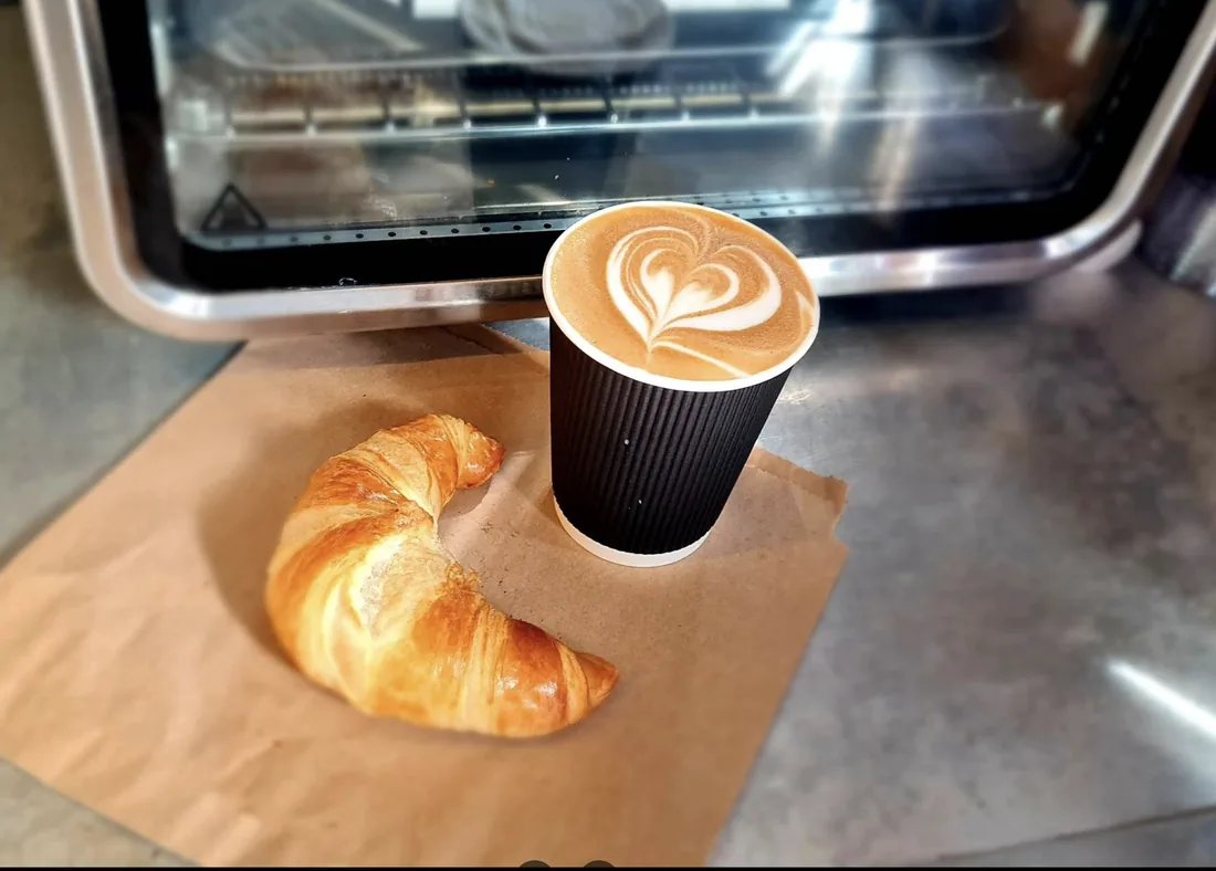 A flat white from Mad Cat, a leaf poured in the crema