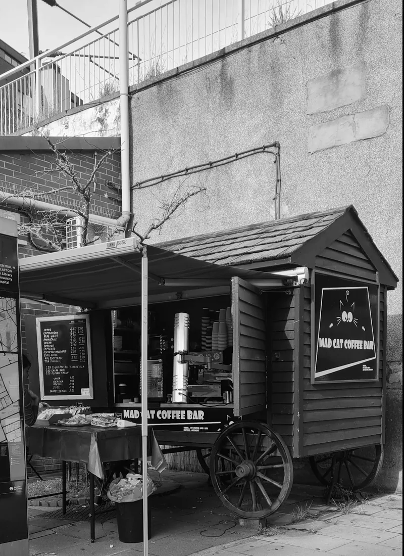 The Mad Cat coffee cart parked under the railway arches in Homerton